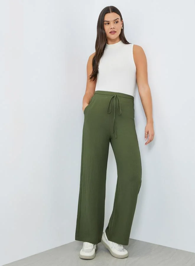 Take Two Dark Green Women Dark Green Textured Wide Leg Trousers for Women | Best Price UAE